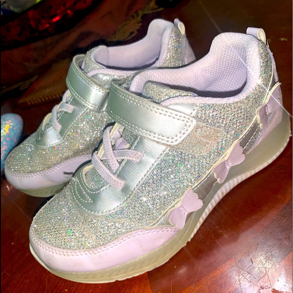 Stride Rite sparkly sneakers. Super comfortable and they light up.